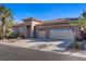 Charming single story home featuring desert landscaping and a three car garage at 11369 Rancho Villa Verde Pl, Las Vegas, NV 89138