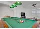 Well-lit game room featuring a pool table with equipment and comfortable seating at 11369 Rancho Villa Verde Pl, Las Vegas, NV 89138