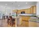 Bright kitchen with an island, stainless steel appliances, and ample cabinet space at 11369 Rancho Villa Verde Pl, Las Vegas, NV 89138