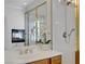 Elegant main bathroom vanity with gold fixtures, shower and a fireplace offering a luxurious and inviting space at 11369 Rancho Villa Verde Pl, Las Vegas, NV 89138