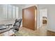Office with a Murphy bed, desk, chair, and window with shutters at 11369 Rancho Villa Verde Pl, Las Vegas, NV 89138
