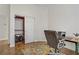 Bright office space featuring a desk, chair, and closet for organized storage at 11369 Rancho Villa Verde Pl, Las Vegas, NV 89138