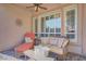 Comfortable outdoor seating on a covered patio, providing a relaxing space to unwind at 11369 Rancho Villa Verde Pl, Las Vegas, NV 89138