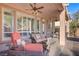 Cozy covered patio featuring comfortable seating, ideal for enjoying the outdoors at 11369 Rancho Villa Verde Pl, Las Vegas, NV 89138