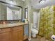 Well-maintained bathroom with a granite vanity, a shower with a curtain, and essential fixtures at 1455 E Katie Ave # K14, Las Vegas, NV 89119