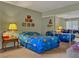 Bright bedroom featuring a bed with a blue comforter and mirrored closet doors at 1455 E Katie Ave # K14, Las Vegas, NV 89119