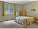 Bright bedroom featuring a cozy bed, ample natural light, and a dresser with storage at 1455 E Katie Ave # K14, Las Vegas, NV 89119