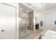 Bathroom featuring a large glass enclosed shower with a built-in bench and modern fixtures at 15 Gemstar Ln, Las Vegas, NV 89135