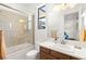 Bathroom showcasing a shower over tub, with tiled walls, and a modern vanity at 15 Gemstar Ln, Las Vegas, NV 89135