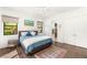 Cozy bedroom with large windows, ensuite bath, and modern furnishings for a relaxing retreat at 15 Gemstar Ln, Las Vegas, NV 89135
