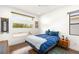 Inviting bedroom with modern windows, hardwood floors, and a tranquil ambiance at 15 Gemstar Ln, Las Vegas, NV 89135
