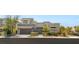 Modern two-story home featuring a two-car garage, desert landscaping, and a gated front walkway at 15 Gemstar Ln, Las Vegas, NV 89135