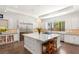 Bright kitchen with stainless steel appliances, large island, and sleek white cabinetry at 15 Gemstar Ln, Las Vegas, NV 89135