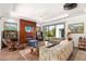 Beautiful living room featuring a modern fireplace, hardwood floors, and comfortable seating arrangement at 15 Gemstar Ln, Las Vegas, NV 89135