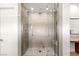 Modern walk-in shower featuring glass enclosure, rainfall shower head, and contemporary design at 15 Gemstar Ln, Las Vegas, NV 89135