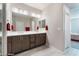 Bathroom with double sinks and tile floors at 19 Cresta Villa Ct, Henderson, NV 89011