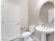 Half bathroom with a pedestal sink and a toilet at 19 Cresta Villa Ct, Henderson, NV 89011