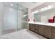 Bathroom with walk in shower, double sinks, and tile floors at 19 Cresta Villa Ct, Henderson, NV 89011