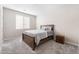 Cozy bedroom with a comfortable bed, plush carpet, and a window for natural light creating a relaxing space at 19 Cresta Villa Ct, Henderson, NV 89011