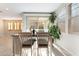 Bright dining area with a wooden table set and large windows at 19 Cresta Villa Ct, Henderson, NV 89011