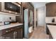 Modern kitchen features stainless steel appliances, white countertops, and dark wood cabinets at 19 Cresta Villa Ct, Henderson, NV 89011