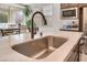 Gourmet kitchen features stainless steel sink, modern faucet, and white countertops at 19 Cresta Villa Ct, Henderson, NV 89011