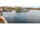 Picturesque view of the lake with boats docked, set against a backdrop of resort-style buildings at 19 Cresta Villa Ct, Henderson, NV 89011