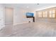 Bright, open living room with tile floors and large windows with window coverings at 19 Cresta Villa Ct, Henderson, NV 89011