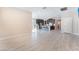 Open living room featuring tile floors, modern light fixtures, and views into kitchen at 19 Cresta Villa Ct, Henderson, NV 89011