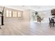Bright living room featuring tile floors, modern light fixtures, and big windows at 19 Cresta Villa Ct, Henderson, NV 89011