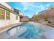 A gorgeous pool with tiled accents is nestled within a lush, landscaped backyard, creating an oasis for relaxation and fun at 19 Cresta Villa Ct, Henderson, NV 89011