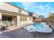 The backyard features a sparkling pool, complemented by an outdoor patio, perfect for relaxation and entertainment at 19 Cresta Villa Ct, Henderson, NV 89011