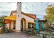 Charming outdoor restaurant patio with shaded seating areas and a European-inspired design at 19 Cresta Villa Ct, Henderson, NV 89011