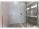 Walk in shower with tile surround and glass door at 19 Cresta Villa Ct, Henderson, NV 89011