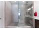 Walk in shower with tile surround and glass door at 19 Cresta Villa Ct, Henderson, NV 89011