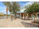 Exterior of a lakefront storefront, showing a beautiful facade with trees and flowering plants at 19 Cresta Villa Ct, Henderson, NV 89011