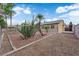 Backyard featuring a fenced yard, gravel landscaping, and desert plants for a low-maintenance outdoor area at 1913 Piccolo Way, Las Vegas, NV 89146