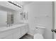 Well-lit bathroom featuring a dual sink vanity, a toilet, and a shower at 1913 Piccolo Way, Las Vegas, NV 89146