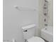 Bright bathroom featuring white fixtures, including a toilet and shower with a shower caddy at 1913 Piccolo Way, Las Vegas, NV 89146