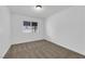 A quiet bedroom with neutral carpet, white walls, and a window at 1913 Piccolo Way, Las Vegas, NV 89146