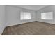 Bright bedroom with two windows and neutral-colored carpeting at 1913 Piccolo Way, Las Vegas, NV 89146