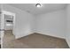 An empty bedroom features neutral carpet, fresh white paint and lots of natural light at 1913 Piccolo Way, Las Vegas, NV 89146