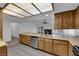 Spacious kitchen with wood cabinets, stainless steel dishwasher, and large countertops at 1913 Piccolo Way, Las Vegas, NV 89146