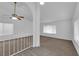 Open concept living room featuring carpeted floors and large windows at 1913 Piccolo Way, Las Vegas, NV 89146