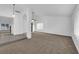 Large, carpeted living room featuring vaulted ceilings and neutral color palette at 1913 Piccolo Way, Las Vegas, NV 89146