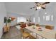 Stylized open-concept living room and dining area with lots of natural light at 1913 Piccolo Way, Las Vegas, NV 89146