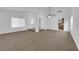 Spacious living room featuring carpeted floors, vaulted ceilings, and open layout at 1913 Piccolo Way, Las Vegas, NV 89146