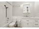 Bathroom with a shower-tub combo, a toilet, and a vanity with a mirror at 2128 Petersham Ct # C, Las Vegas, NV 89108