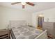 Comfortable bedroom with modern ceiling fan and ensuite access to a closet at 2128 Petersham Ct # C, Las Vegas, NV 89108