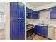 Charming kitchen featuring stainless steel appliances and custom blue cabinetry at 2128 Petersham Ct # C, Las Vegas, NV 89108